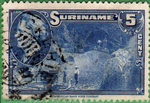 Surinam stamp with mine truck at a gold mine in Lore